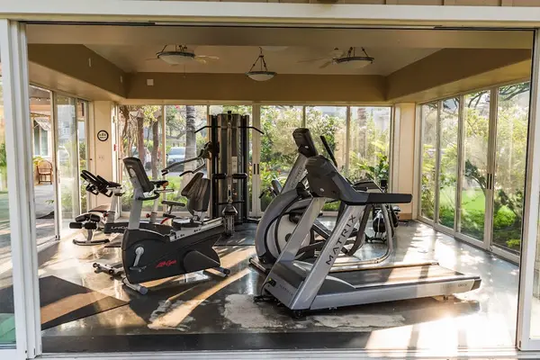 On-Site Gym with Exercise Equipment & Glass Walls