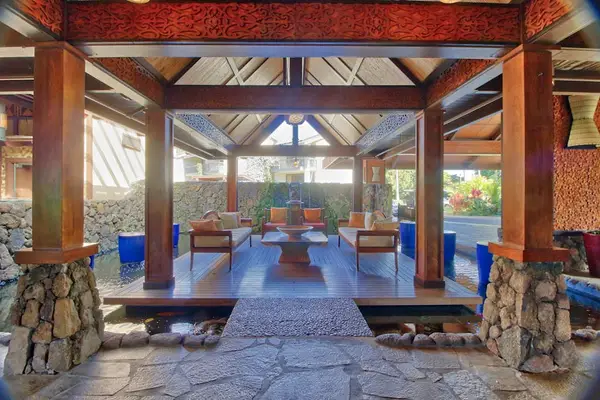 Unwind inside this breezy pavilion surrounded by peaceful tropical scenery