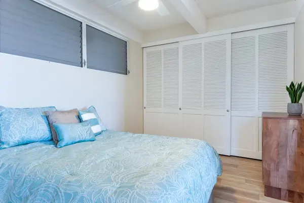 Comfortable Bed, Large Sliding Closet, Wooden Dresser & Ceiling Fan