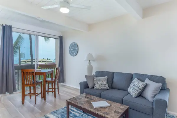 Plush Sofa, Coffee Table, Dining High-Top Table & Balcony Access