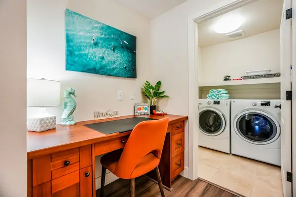 Convenient Laundry Room With Workspace