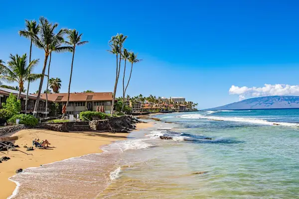Relax on the golden sandy beach with stunning ocean views just steps away.