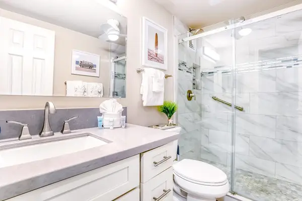 Fabulous newly remodeled bathroom with luxurious and spacious walk in tiled shower.