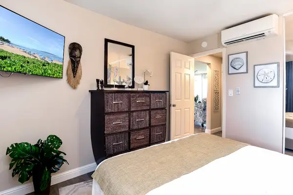 Luxurious queen size bed with ceiling fan for comfort and flat screen tv so that you can unwind.