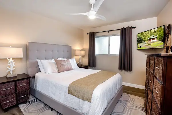 Luxurious queen size bed with ceiling fan for comfort and flat screen tv so that you can unwind.