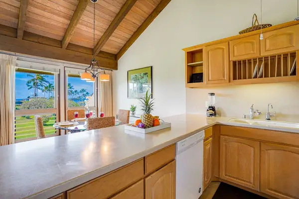 Spacious Kitchen Breakfast Bar Overlooking Dining Area & Ocean Horizon
