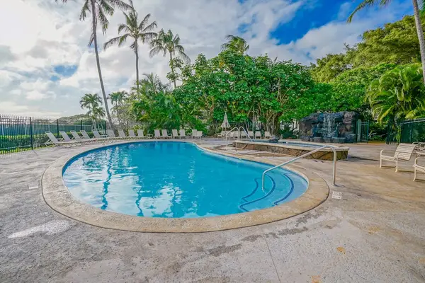 Resort Swimming Pool Area featuring Decorative Waterfall Feature