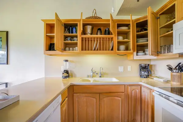 Fully Equipped Kitchen with Open Wooden Cabinets & Under-Cabinet Lighting