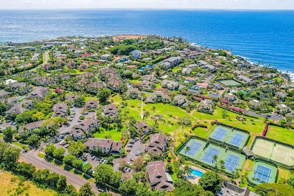Aerial View of Coastal Resort Property & Surrounding Ocean Landscape