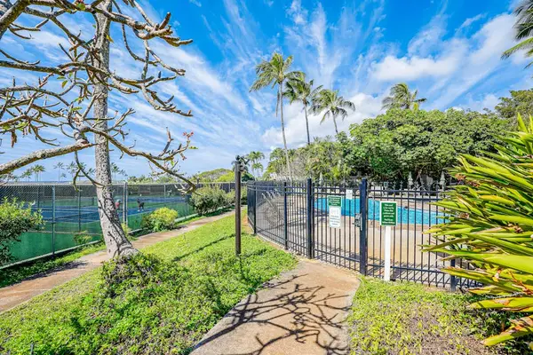 Fenced Pool Entry Walkway Adjacent to Outdoor Tennis Courts