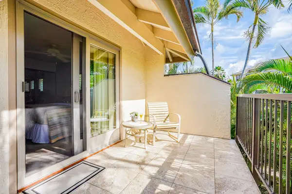 Private Bedroom Balcony Seating Area with Tiled Flooring & Tropical Views