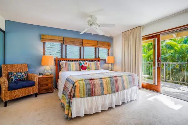 Primary Bedroom Suite with King Bed, Wicker Accent Chair & Private Balcony