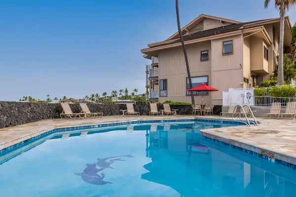 Resort Pool with Building & Ocean Backdrop