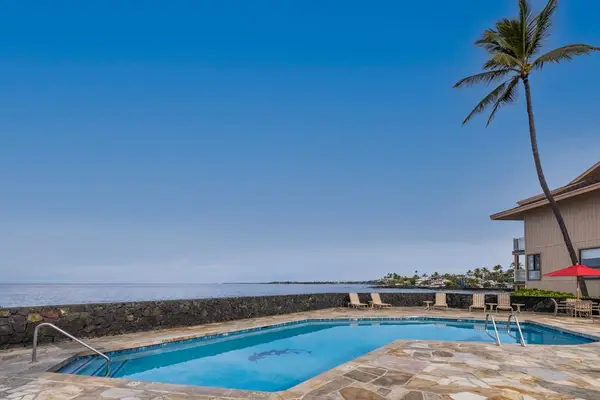 Oceanfront pool with endless blue views the ultimate spot to unwind and soak up the sun
