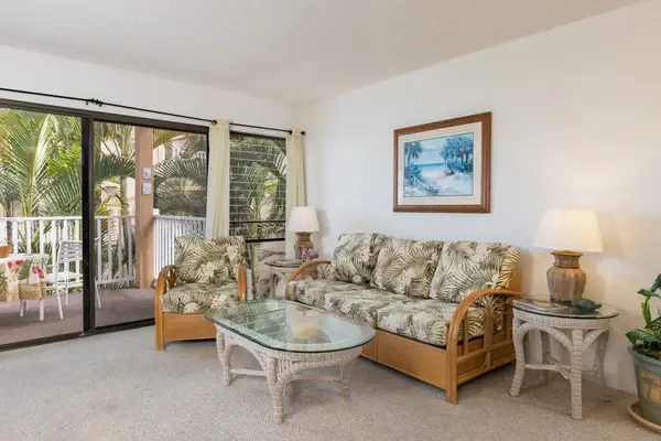 Tropical-Style Living Room with Wicker Furniture & Patio View