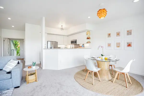 Bright, open-plan layout connecting the living and dining areas with pleasant outdoor light