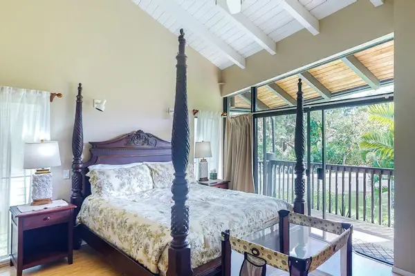 Spacious king suite with an antique four-poster bed — plus a crib for your little one