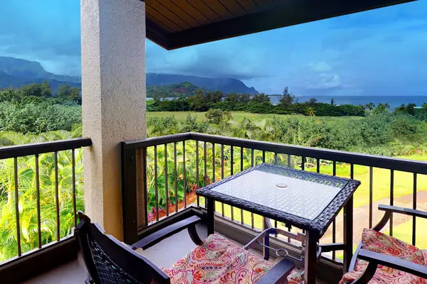 Enjoy morning coffee outside while admiring sweeping tropical island views