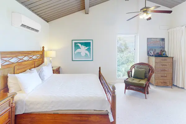 Recharge comfortably in this airy bedroom after exciting island adventures