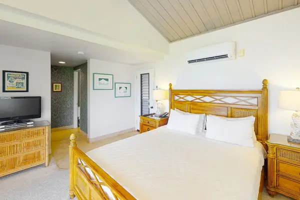 Rest comfortably in this bright bedroom with peaceful island-inspired surroundings