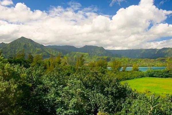 Take in breathtaking mountain scenery beneath beautiful bright island skies