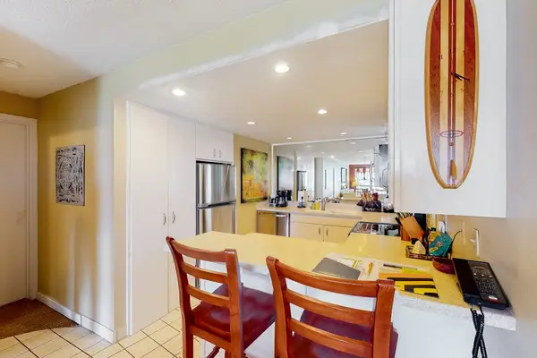 Modern kitchen offers stainless appliances, generous counters, and convenient storage
