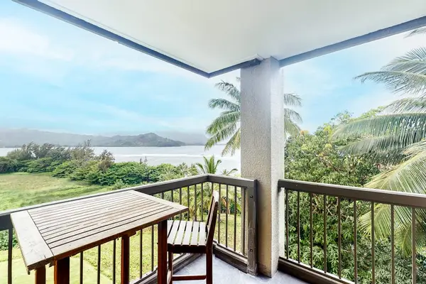 Covered balcony provides dining space, mountain views, and refreshing breezes