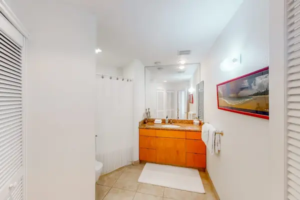 Fresh bathroom combines a spacious vanity, tilework, and contemporary fixtures