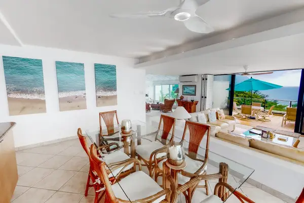 Dining room presents a welcoming table arrangement beside expansive windows