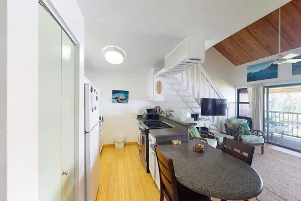 Bright kitchen features appliances counters and convenient meal preparation space