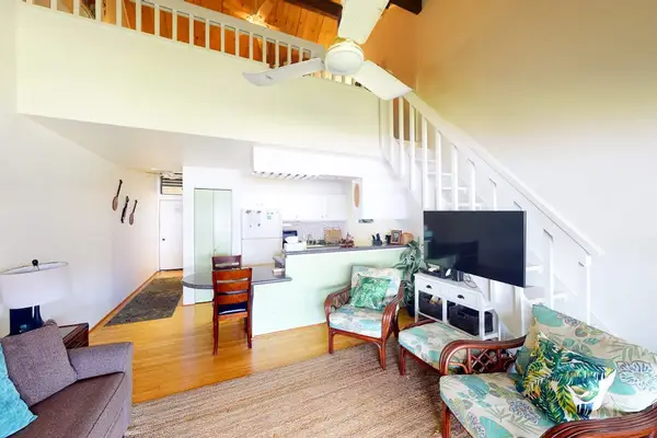 Bright open concept living room offers inviting seating and seamless shared living spaces
