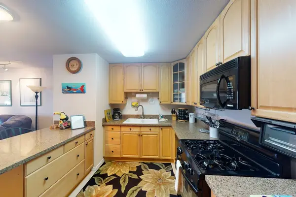 Well equipped kitchen offers appliances counters and meal preparation space