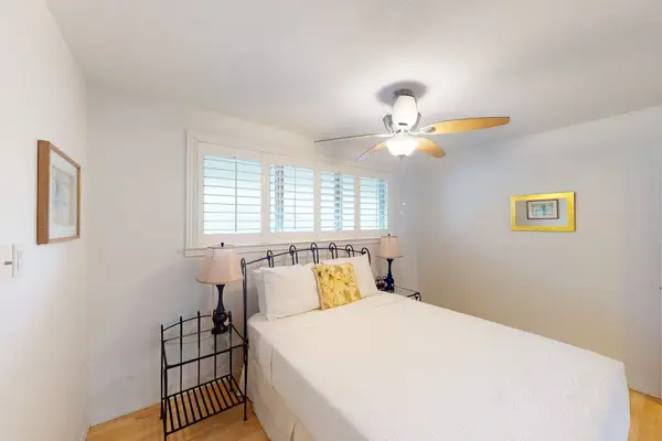 Peaceful bedroom with ceiling fan keeps the space cool and inviting every night