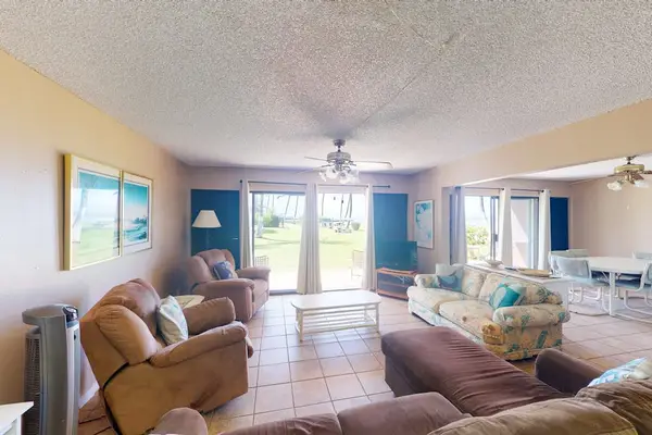 Bright living room with glass door welcoming abundant natural light inside
