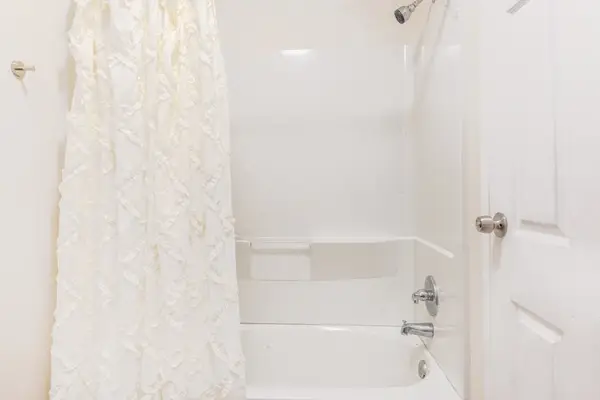 Full bathroom with tub/shower combo.