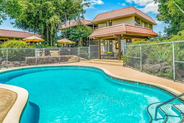 Outdoor Pool Area with Pavilion and Property Exterior View