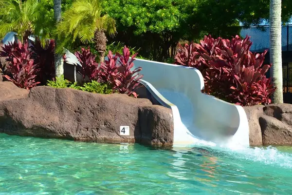 Resort Pool With Waterslide Fun