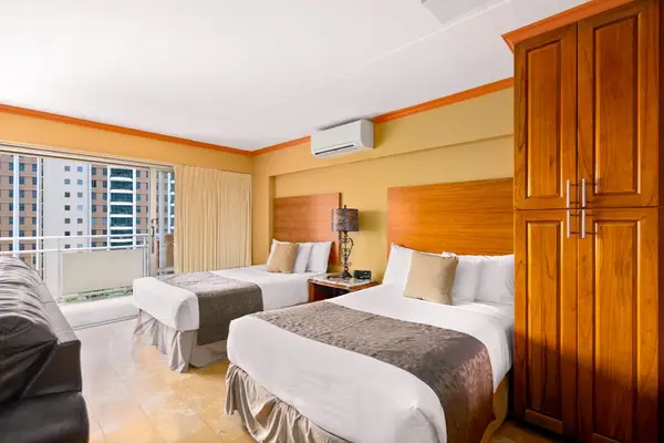 Cozy sleeping space with two double beds feels welcoming from arrival onward