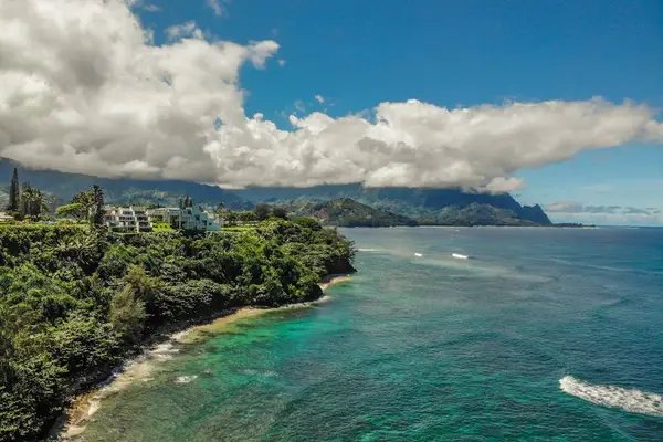 Aerial view of the coastline, showcasing crystal-clear turquoise waters