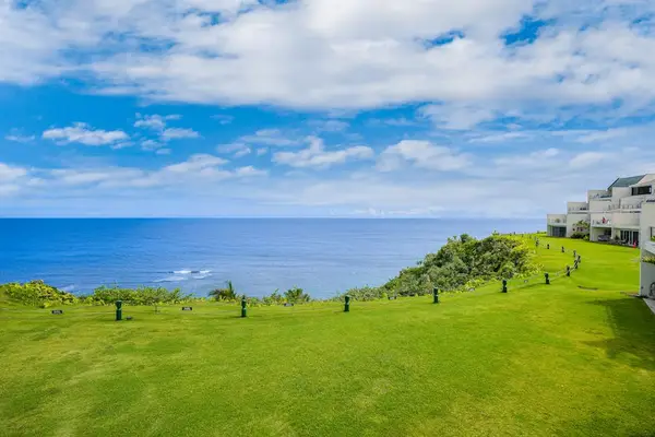 Expansive oceanfront lawn offering breathtaking views and plenty of space to relax or play