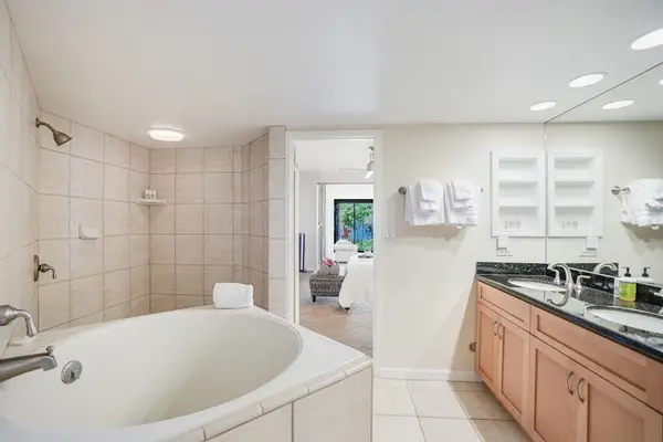 Spacious bathroom with a soaking tub and dual vanity