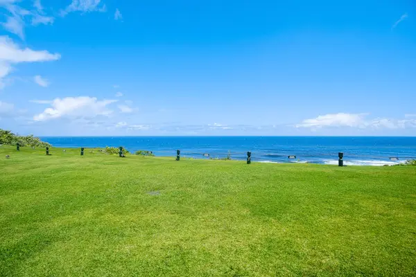 Enjoy panoramic ocean views from the lush lawn