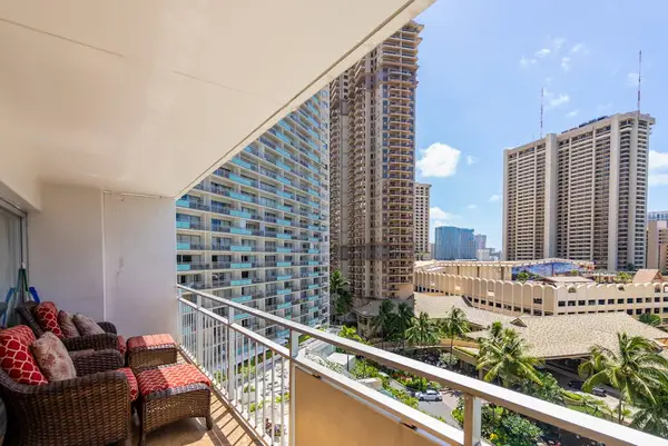 Comfortable balcony seating pairs perfectly with peaceful glimpses of the nearby shoreline