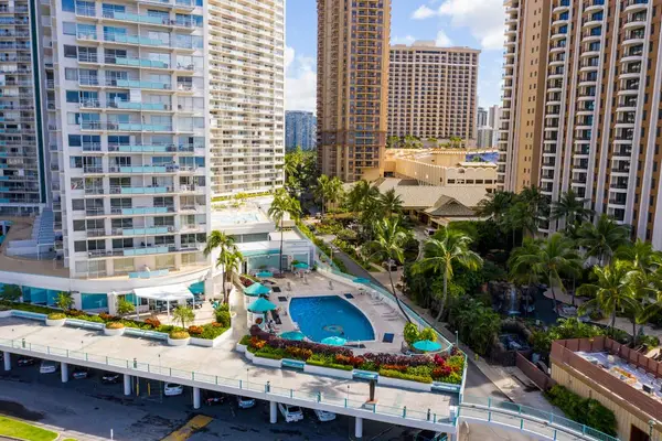Bird's eye view showcases the inviting shared pool surrounded by tropical beauty