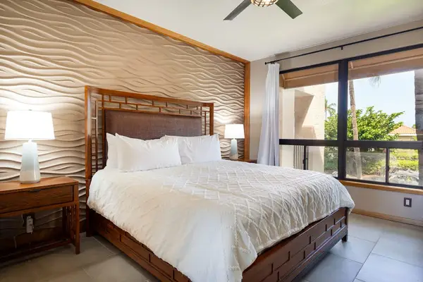 Bright Primary Bedroom With Tropical Character