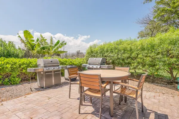 Inviting Community Poolside BBQ Area