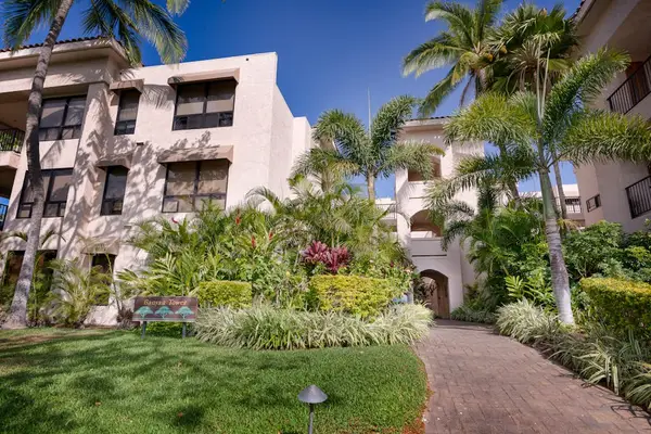 Beautifully Landscaped Entrance Surrounded By Tropical Greenery