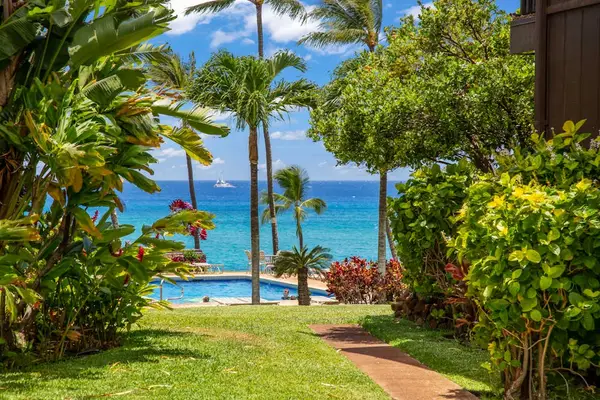 Mahina Surf Resort grounds full of tropical foliage.