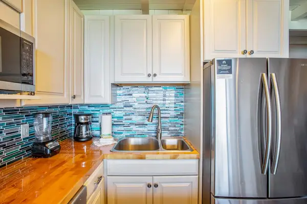 Newly remodeled kitchen with stainless steel appliances.