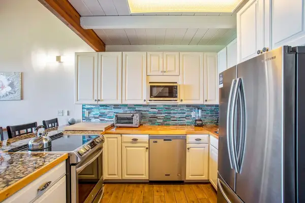 Newly remodeled kitchen with stainless steel appliances.